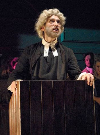 Adam is dressed as a vicar in the Vicar of Wakefield